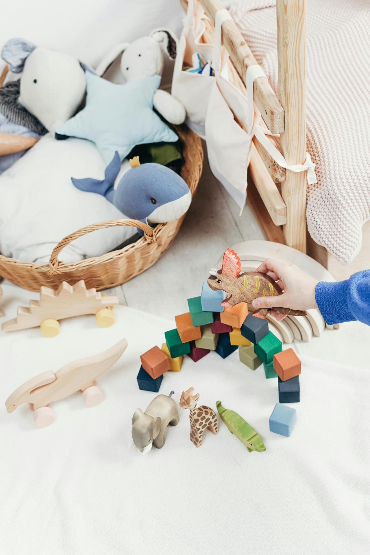 Child playing with wooden toys